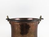 an old copper pot with a handle on a white background