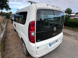 a white van that is parked on the side of the road