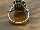 an image of a diamond ring on a wooden table