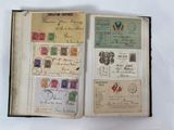 an open book with stamps and stamps on it sitting on a table