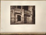 an old photo of a building with a staircase and a balcony