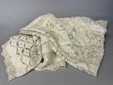 an image of a pile of white lace on a gray surface