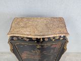 an image of a black and gold chest of drawers