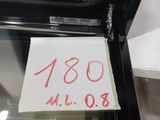 a piece of paper taped to the glass door of an oven