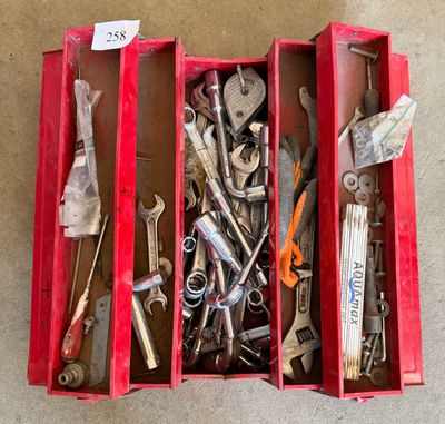 many tools in a red box on the floor