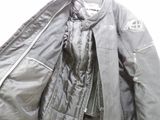 a jacket that is hanging up on a hanger