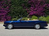 a picture of a blue convertible car parked in a parking lot