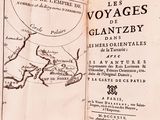 an old book with a map on it sitting on a table
