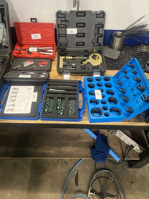 a table with many tools on it in a garage