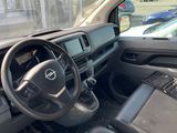 the interior of a car with a steering wheel and dashboard