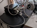 a bunch of wires that are tangled up on a desk