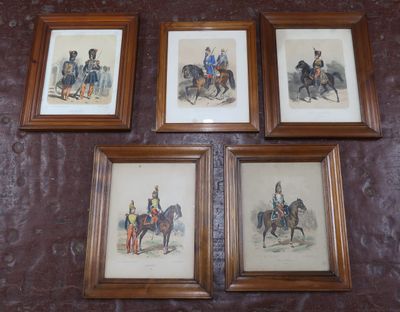 four framed pictures of men on horseback mounted on a wall