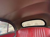 a red leather seat in the back of a car