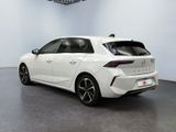 the rear end of a white car in a white room