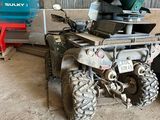 a green machine that is sitting in a garage