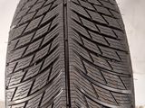 a close up of a tire on a white surface