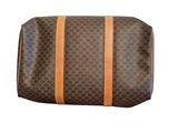 a brown and tan bag with orange straps on a white background