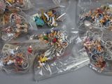 a lot of small plastic toys in bags on a table