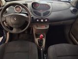 dashboard view of a small car with a steering wheel and dashboard controls