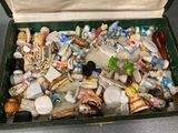 a green box filled with assorted items on a table