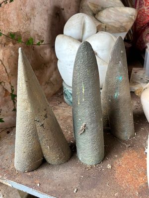 a pile of cement cones sitting on top of a table