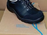 a box with a pair of black boots on it