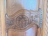 a wooden door with carvings on it in a room