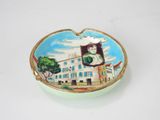 a small bowl with a picture of a woman on it