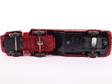 a red toy truck that is sitting on a white surface