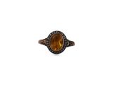 an oval citrine and diamond ring