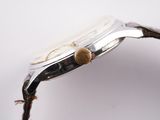 an image of a close up of a watch on a white surface