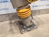 a close up of a metal object on a metal stand