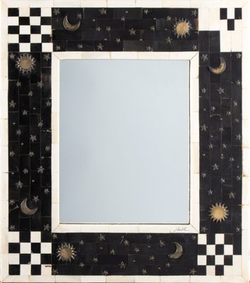 black and white mosaic mirror with stars, moon, and crescents