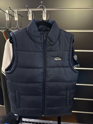 the vest is hanging on a rack in the store