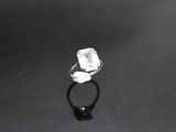 a close up of a ring on a black surface