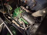 a close up of a green engine in a car