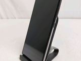a cell phone that is sitting on top of a stand