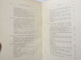 a person holding a book open to a page of text