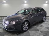 a picture of a grey car parked in a garage