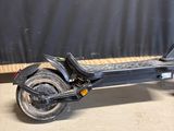 an image of an electric scooter parked in a garage