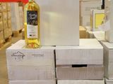 boxes stacked on top of each other with a bottle of wine on top of them