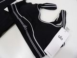 two pieces of clothing on a table with a price tag