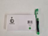 a green pen sitting on top of a white envelope