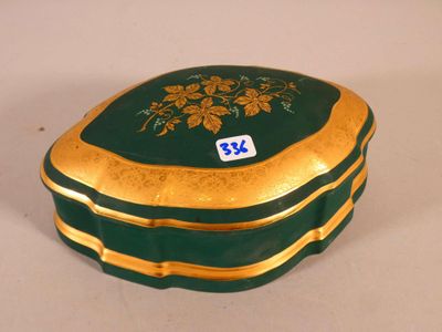 a green and gold box with a number on it