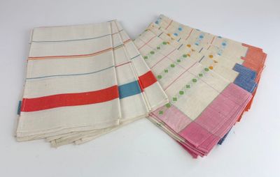 several different colored napkins are stacked on top of each other