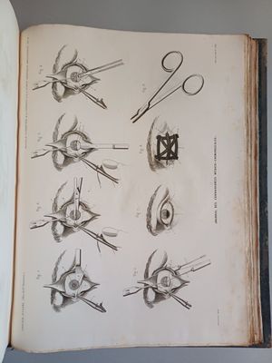 an open book with drawings of scissors and other things on it