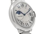 a close up of a wrist watch with a white dial and roman numerals