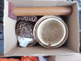 a box with a bowl and a rolling pin inside of it