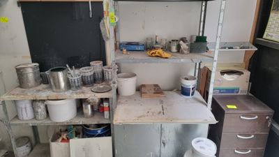 a small kitchen with lots of pots and pans on the counter