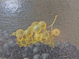 a painting of grapes and grapes on a table